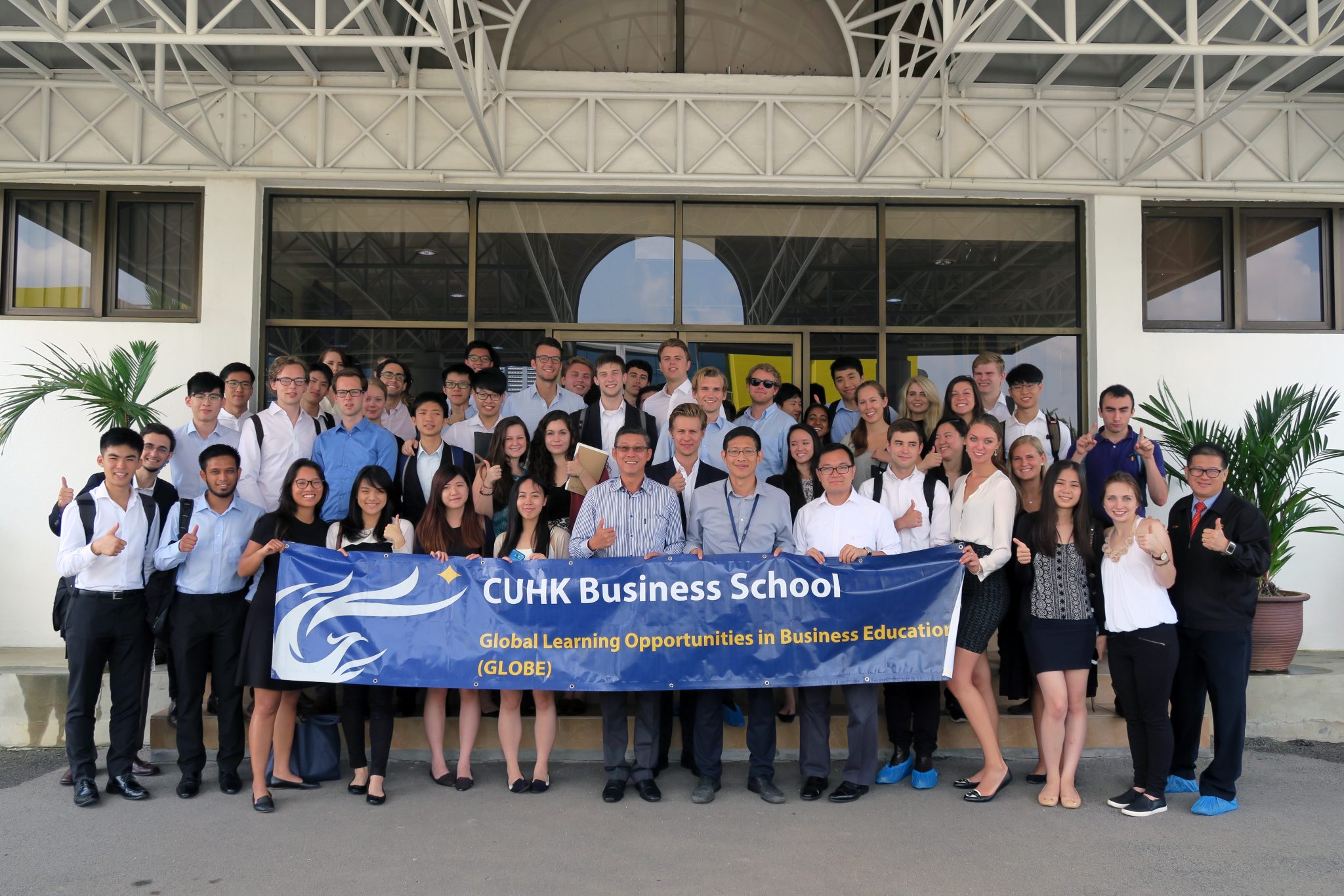 The students posed for a group photo during a company visit.